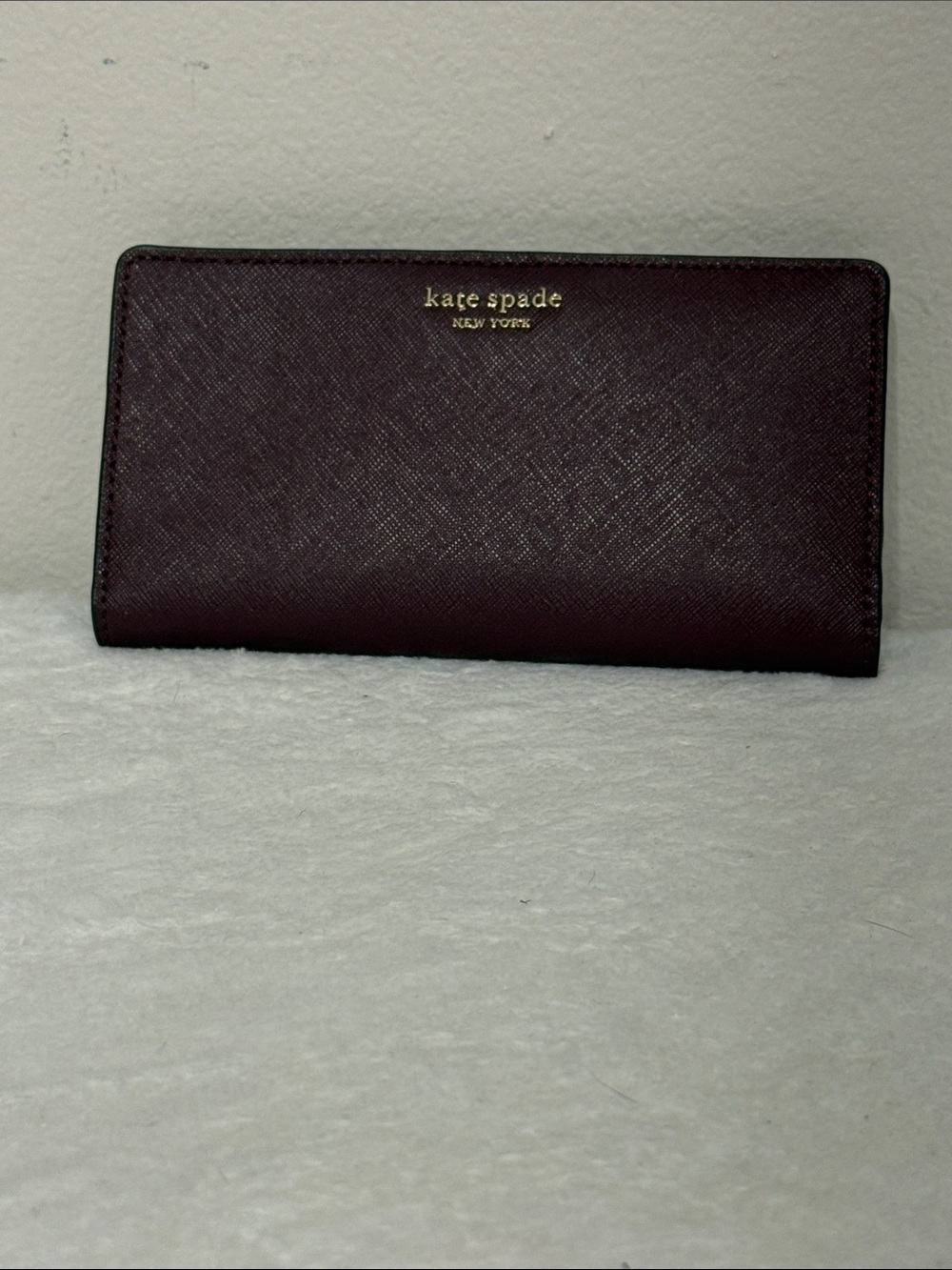 kate spade plum Saffiano leather continental wallet with gold logo